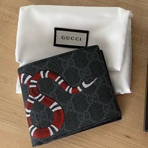 Gucci
Black/grey GG Supreme canvas with Kingsnake print
Black leather trim